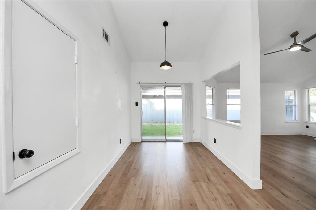 Dining room located between kitchen and patio.