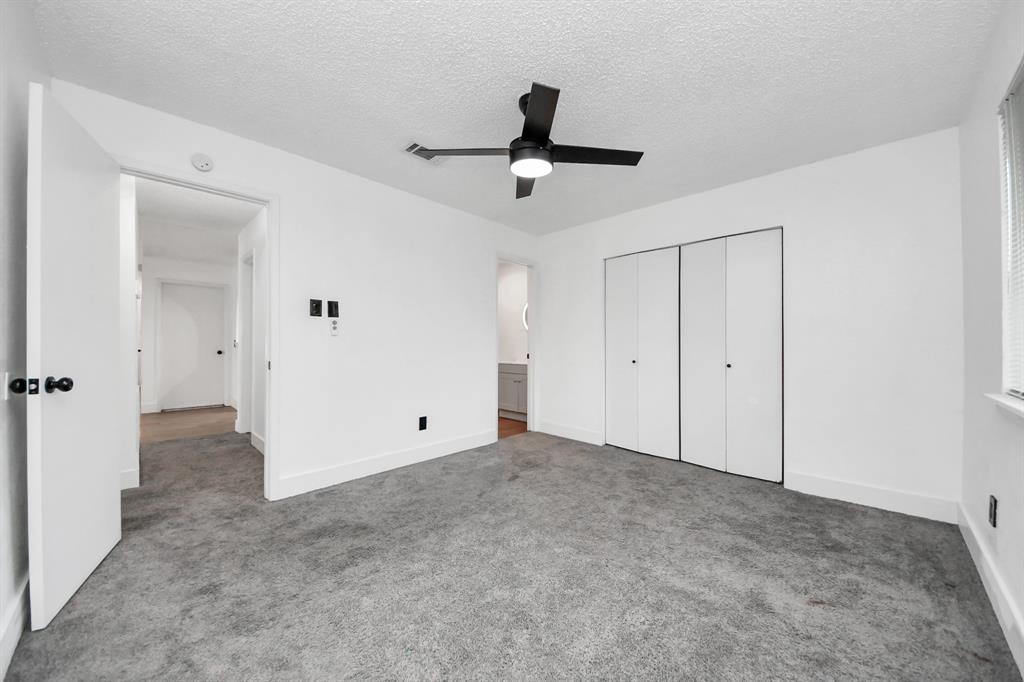 Another view of the primary bedroom