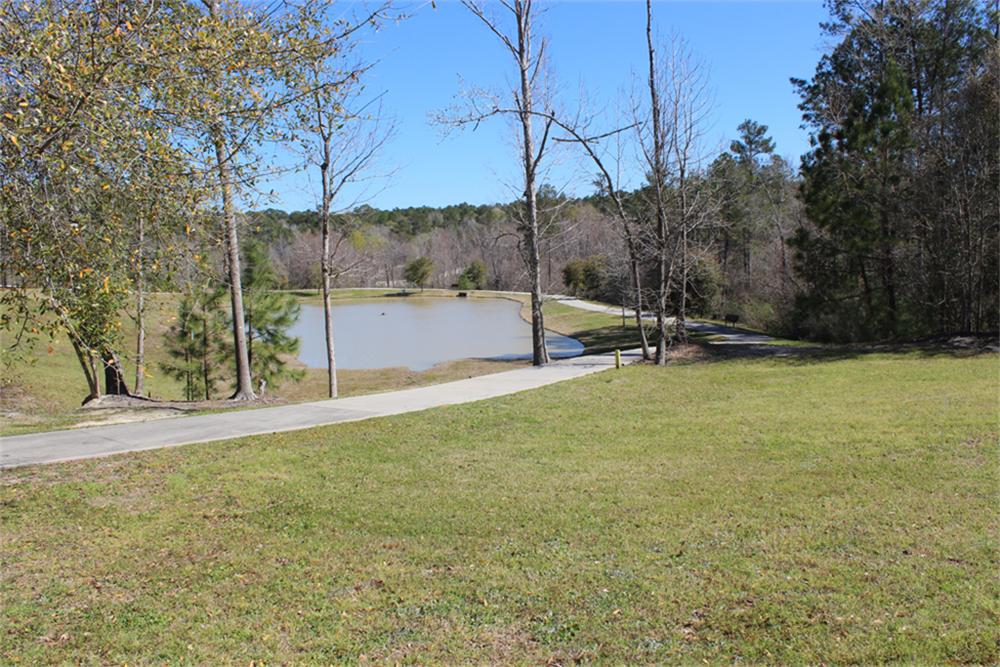 6150 Waltons Point Conroe, Texas OWNER MOTIVATED! THIS IS A ONE-OF-A- KIND CORNER LOT, OVERLOOKING A PARK, LAKE & LIGHTED WATER FOUNTAIN. A CONCRETE SIDEWALK runs along one side, all the way to the back of property. Spring at very back of property. Owner has architectural plans for the lot which take advantage of the views of the water and lighted fountain. You can hear the water from the lot. WAS ORIGINALLY PART OF THE PARK!